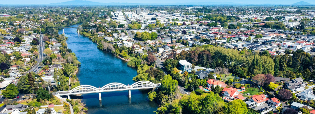A picture of a bridge across the Waikato River on a sunny day