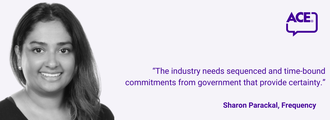 Sharon Parackal, shoulder length dark hair, smiling.