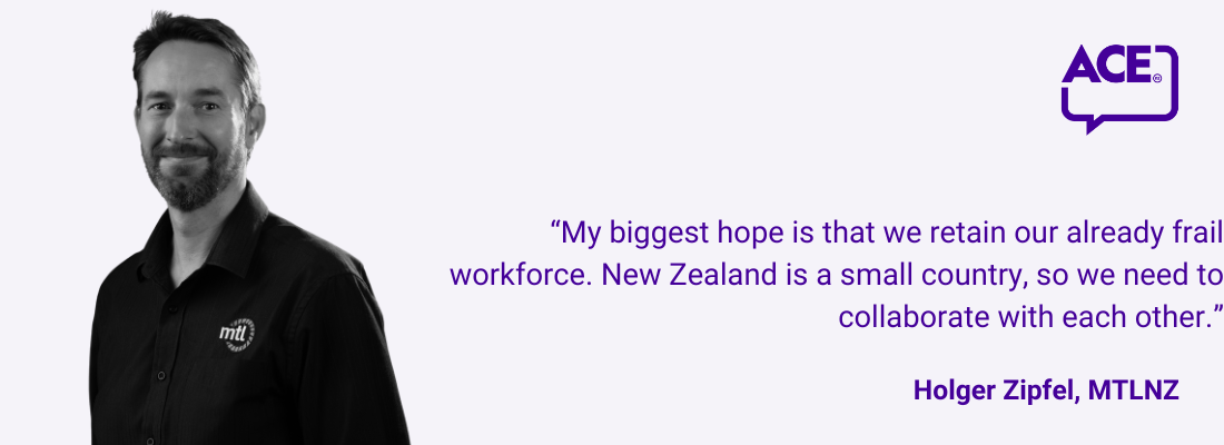 Holger Zipfel, short dark hair, beard, smiling.