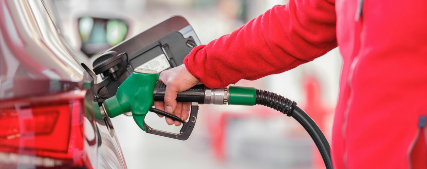 A person pumping fuel at a petrol station