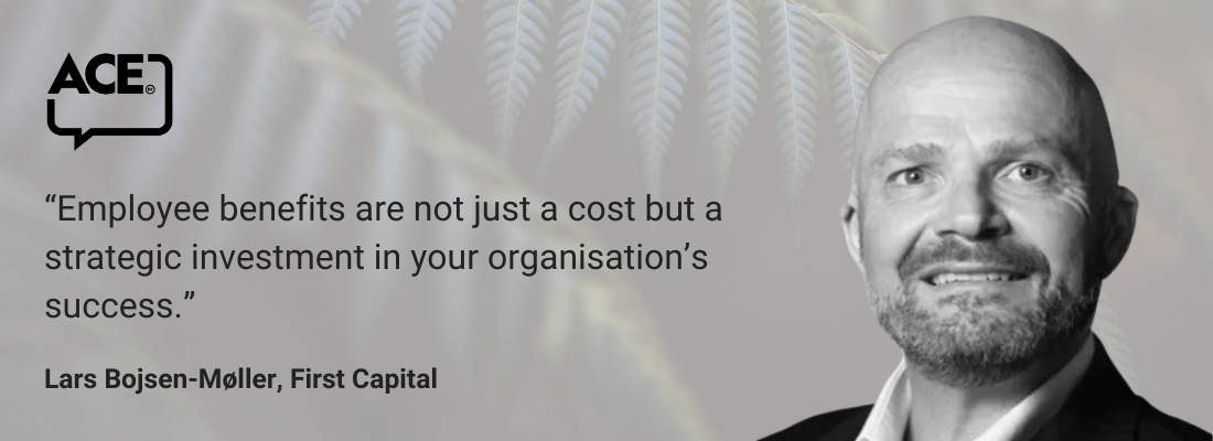 White male, bald, beard and moustache, suit, smiling.