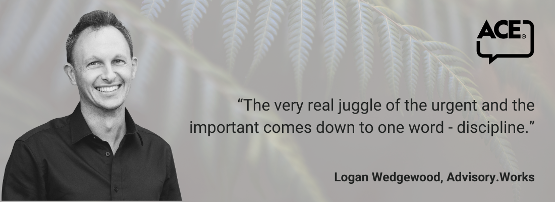 White male, short dark hair, smiling, dark shirt.