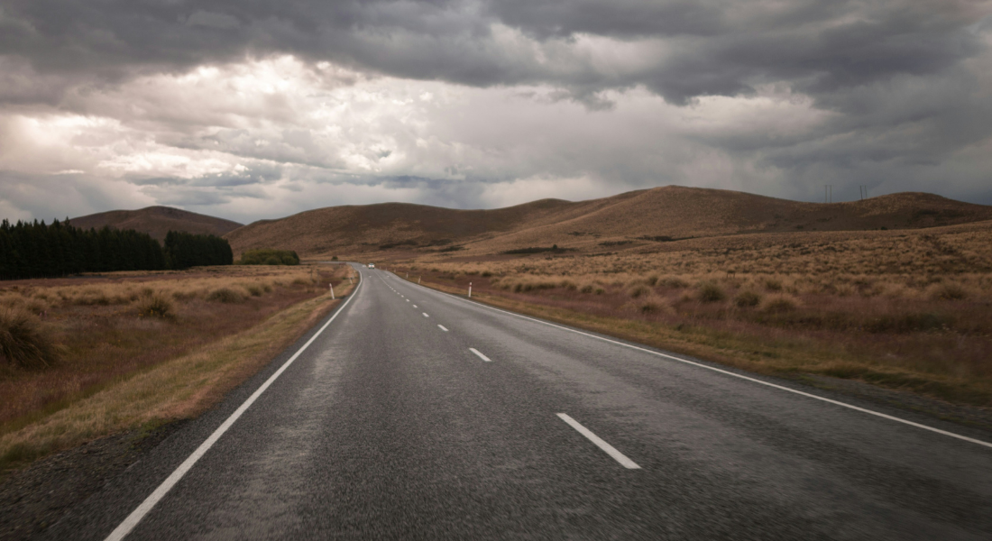 A road stretching out into a grey sky