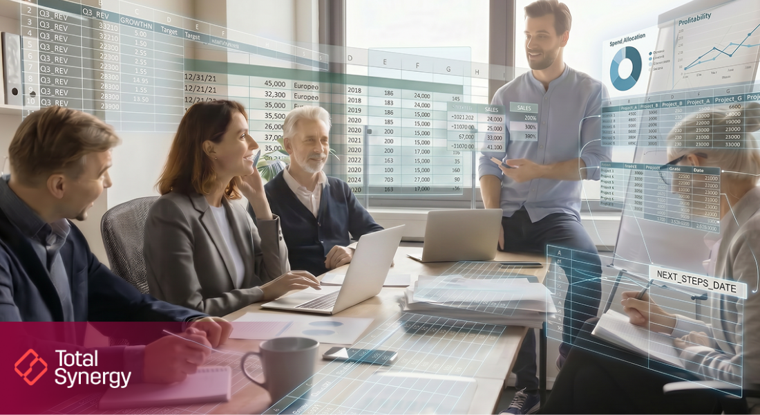Two females, three males in an office meeting, smiling, engaged.